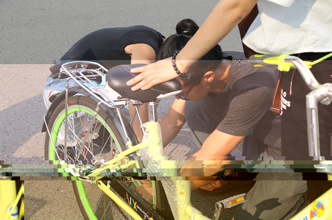 傳遞正能量，服務江大人——騎迹自行車俱樂部舉辦公益修車活動